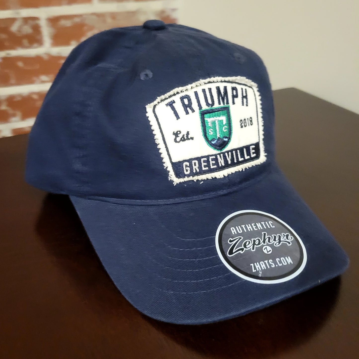 Triumph Checkbook Adj. Hat